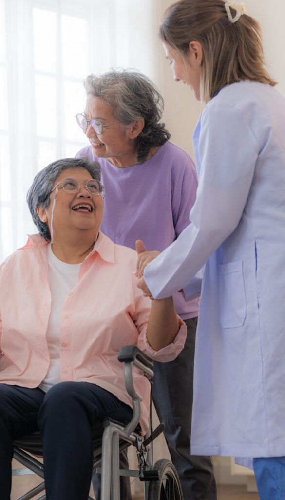 Senior resident holding hands with doctor